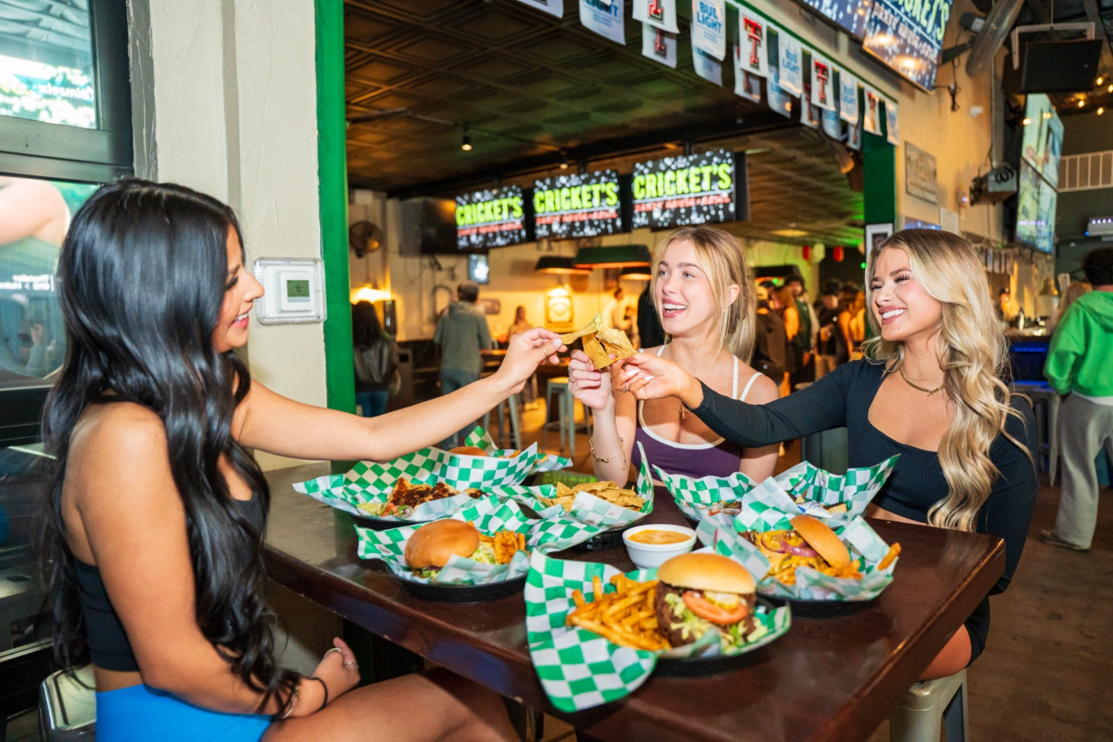 Friends sharing food at Crickets
